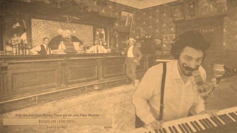 Man from History Times plays you tunes on his Old Pianola Machine