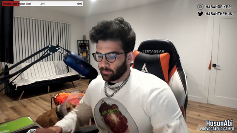 Hasan's dog fish is now a cone boy and he hates it.