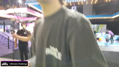 Adept stands next to T1
