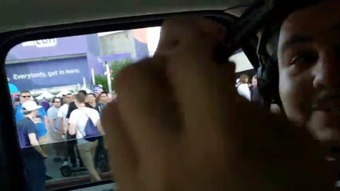 Fan tries to take a picture with greek