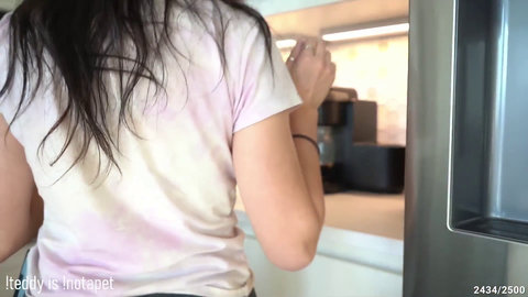 maya gets some milk for her coffee
