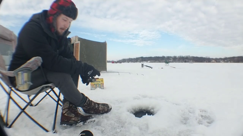 Ice cracking on lake as truck drives by