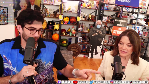 Presidential candidate Williamson notices Hasan's cardboard cutout