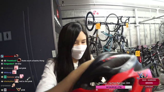 Dad prepares his daughter for a bicycle ride