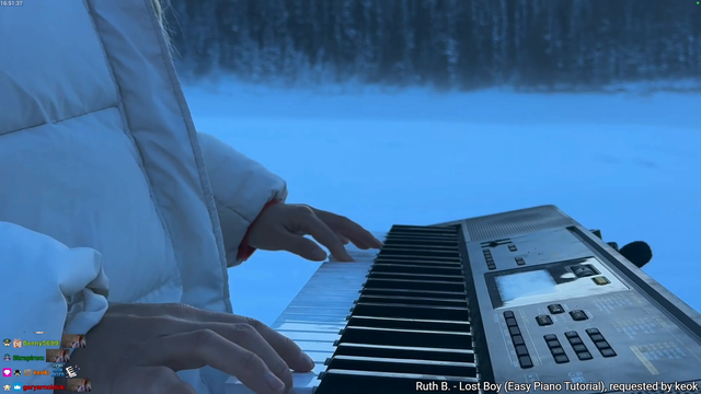 Hachu plays piano on a frozen lake