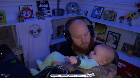Tim's son tries to give rip his dad's beard off.