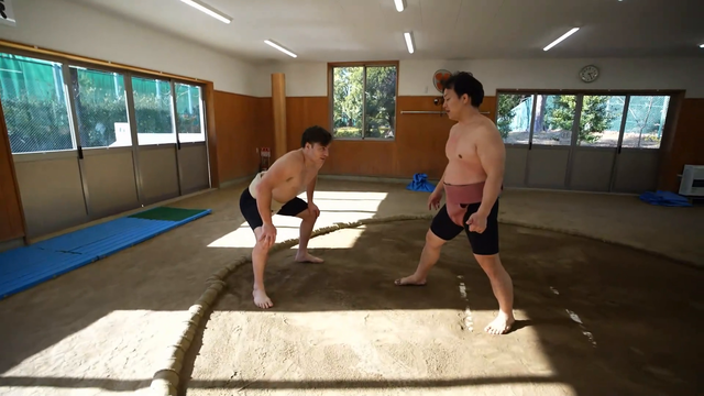 WillNeff tries to move a Sumo wrestler
