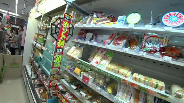 White devil asks friend if she wants to eat something phallic.