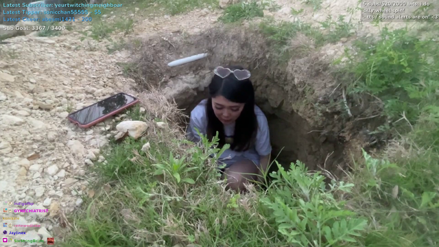Facing starvation after falling into Erobb's hole, ExtraEmily begins eating rocks.