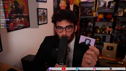 Hasan got it twisted IRL at a casino with a business card with Trainwrecks' face on it