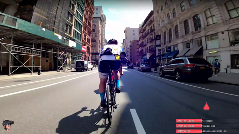 Cyclists break formation mid race at a red light