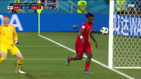 Belgian player celebrating teammates goal against England