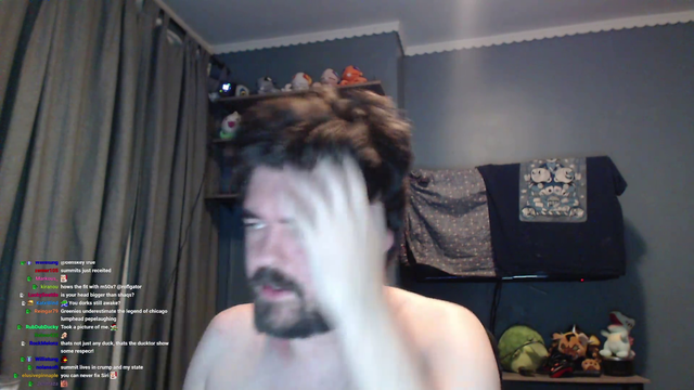 Naked man demonstrates the size of his head on stream