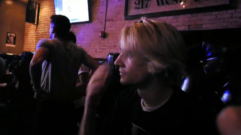 Mizkif asks a stranger to take a picture of the boys at the gay bar