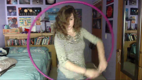 Girl hula hooping surprised by her biggest fan.