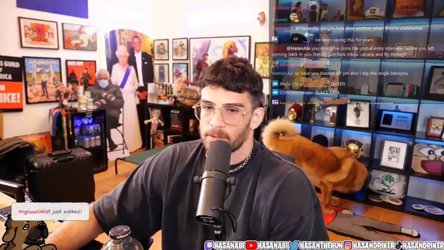 Big LA Streamer reaches over to something on his desk when he is upset that his dog is sniffing around