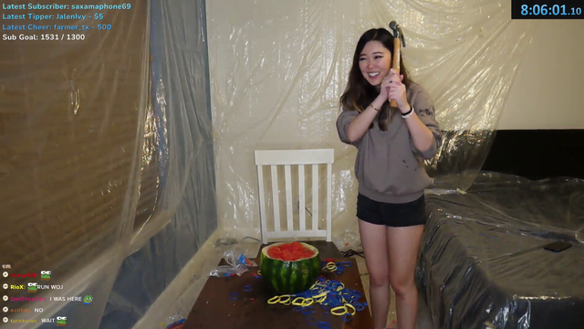 ExtraEmily takes a hammer to the remnants of the melon and Wojitos table.