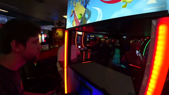 A child cries at an arcade game
