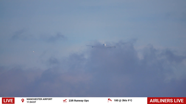 Airbus A380 breaking through the clouds at Manchester