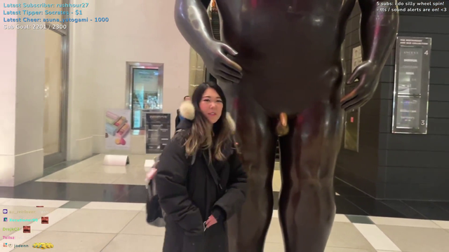 ExtraEmily has a stranger take a picture of her.