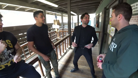 Americans performing ritual before having fun at a shooting range