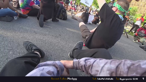 BLM speaker shakes white streamer hand
