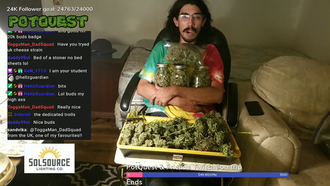 guy hugging jars of cannabis says he likes pot