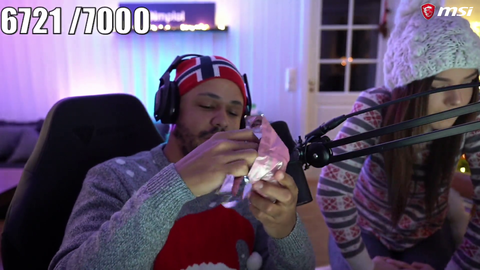 Nick opens a present from Malena