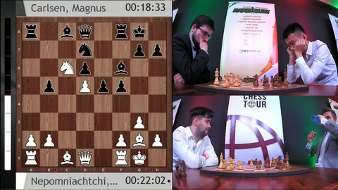 Magnus Carlsen laughing in a chess tournament.