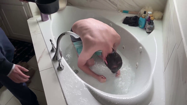 Father Cyr baptizes Chance