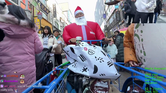 Santa distributes gifts to the kids