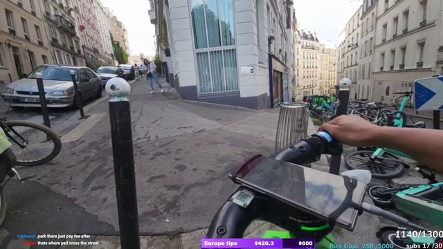 Car driving over Scooters in the streets of Paris