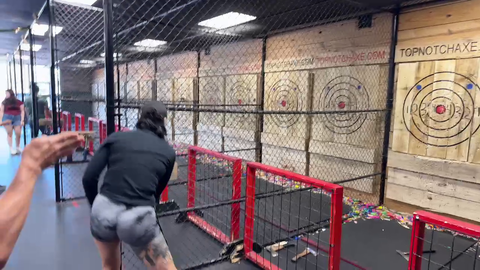 Julia throws an axe the long way