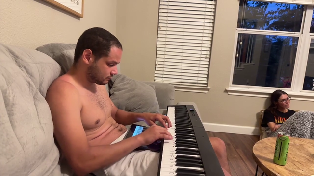 Erobb221 plays the piano to drown out the sound of the world laughing at him