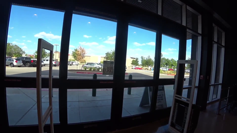 Nick waits for someone to enter the store so he can leave