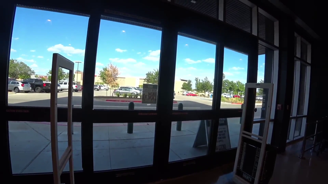 Nick waits for someone to enter the store so he can leave
