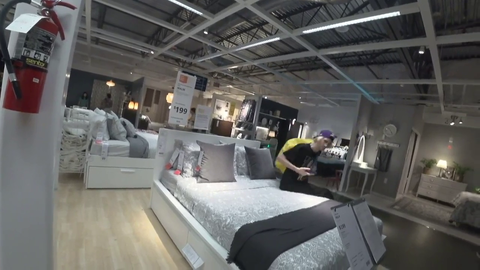 Two roommates shopping for a bed