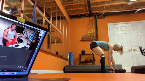 Knut helps Sereda (and chat) with squats.