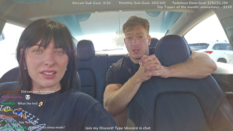 Julia and Arrav struggle using a Tesla