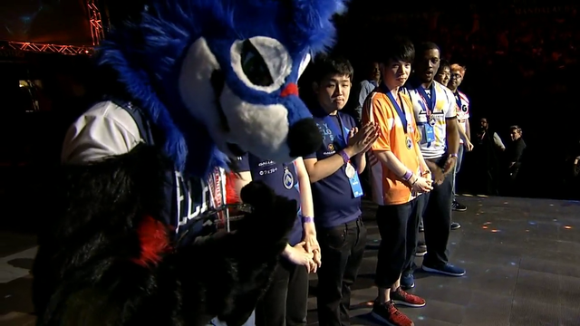 Winner of DBFZ final makes loser put medal on.
