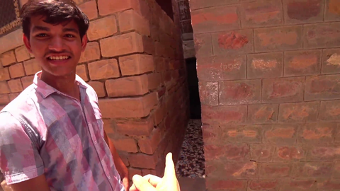 Jay finds extremely small doorway to a shop