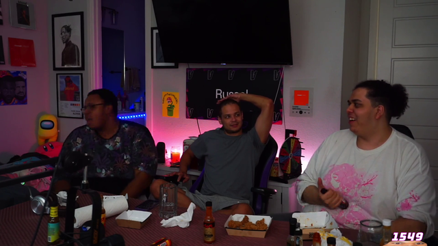 Three grown men laugh at fart sounds