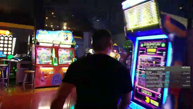 Ape visits the basketball section of the arcade