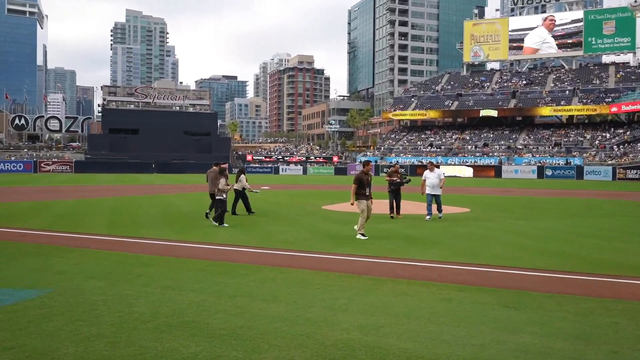 Emiru throws the first pitch at the Padres vs Dodgers game