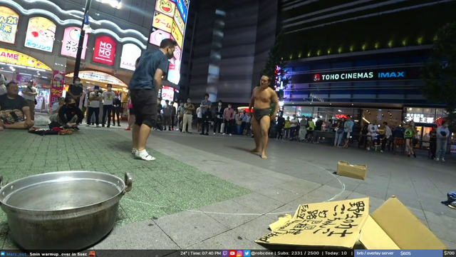Robcdee gets manhandled by a sumo wrestler