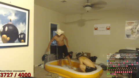 Erobb and Mizkif wrestle in a pool of peanut butter