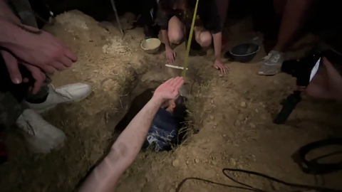 Erobb and 20 others finish digging a 5 feet hole after 12 hours