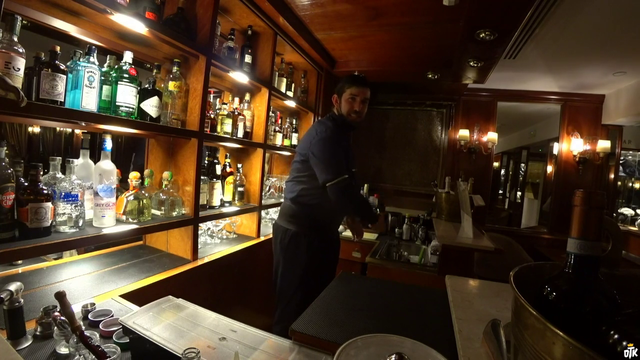 Bartender in Venice, Italy says a joke to Rich
