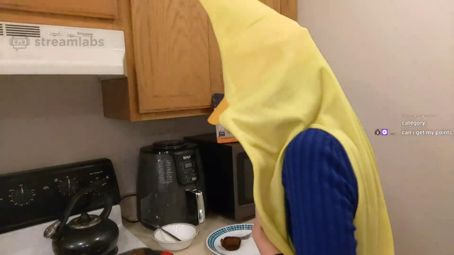 Anie almost burns her kitchen down in a banana suit