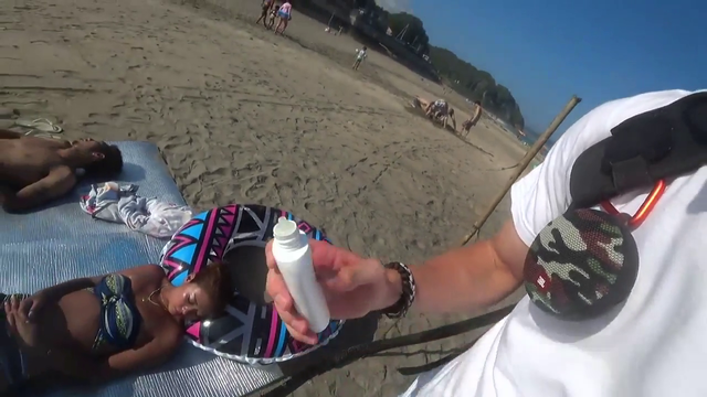 Jakenbake draws a penis tan line on a sleeping girl at the beach.